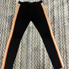 orange stripe on the side of the jeans