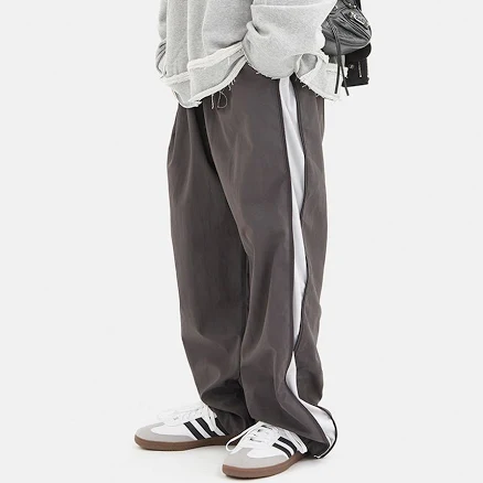 Oblique side zip-up wide banding pants