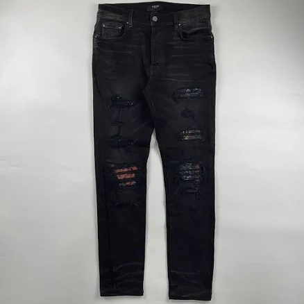 amiri mx1 vintage tee animation patch jeans